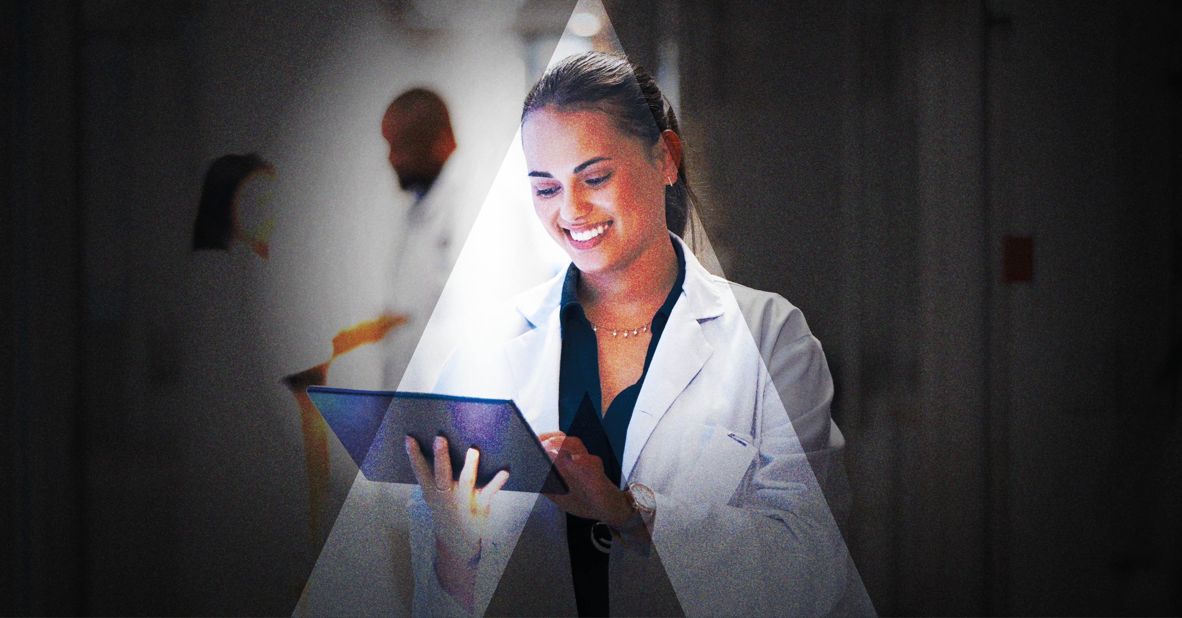 Clinician reviewing a tablet in a hospital corridor, surveying the kind of evidence she would expect at a healthcare congress