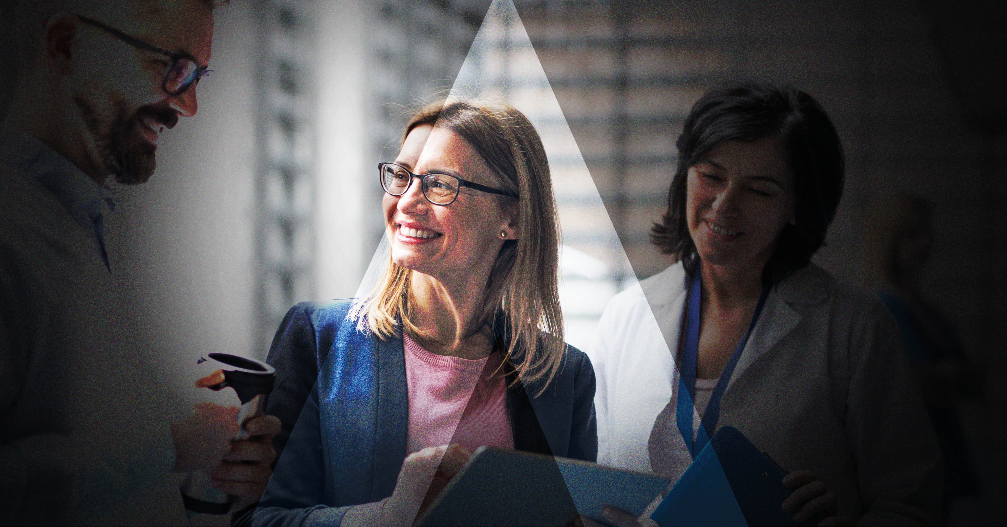 Mixed commercial and clinical team in conversation during a first-time healthcare product launch