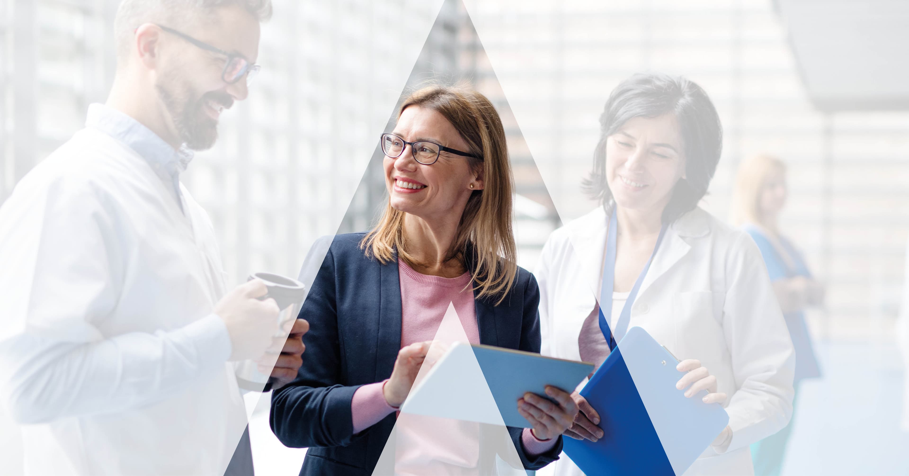 A commercial leader (centre) reviewing data with two clinicians - the boardroom-to-bedside view AGENCY engagements are built around.